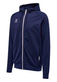 Marine blauwe ritssluiting hoodie van een katoenen blend, met een trekkoordcapuchon, voorzakken en een contrasterende rits. Hummel-logo op de borst.