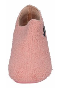 Pink fuzzy slippers with a textured exterior, slip-on design, and a rounded toe. Features a soft lining and a small brand tag.