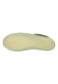 Light-colored footwear sole with a textured surface featuring circular bump patterns; smooth edges with a low-profile design.