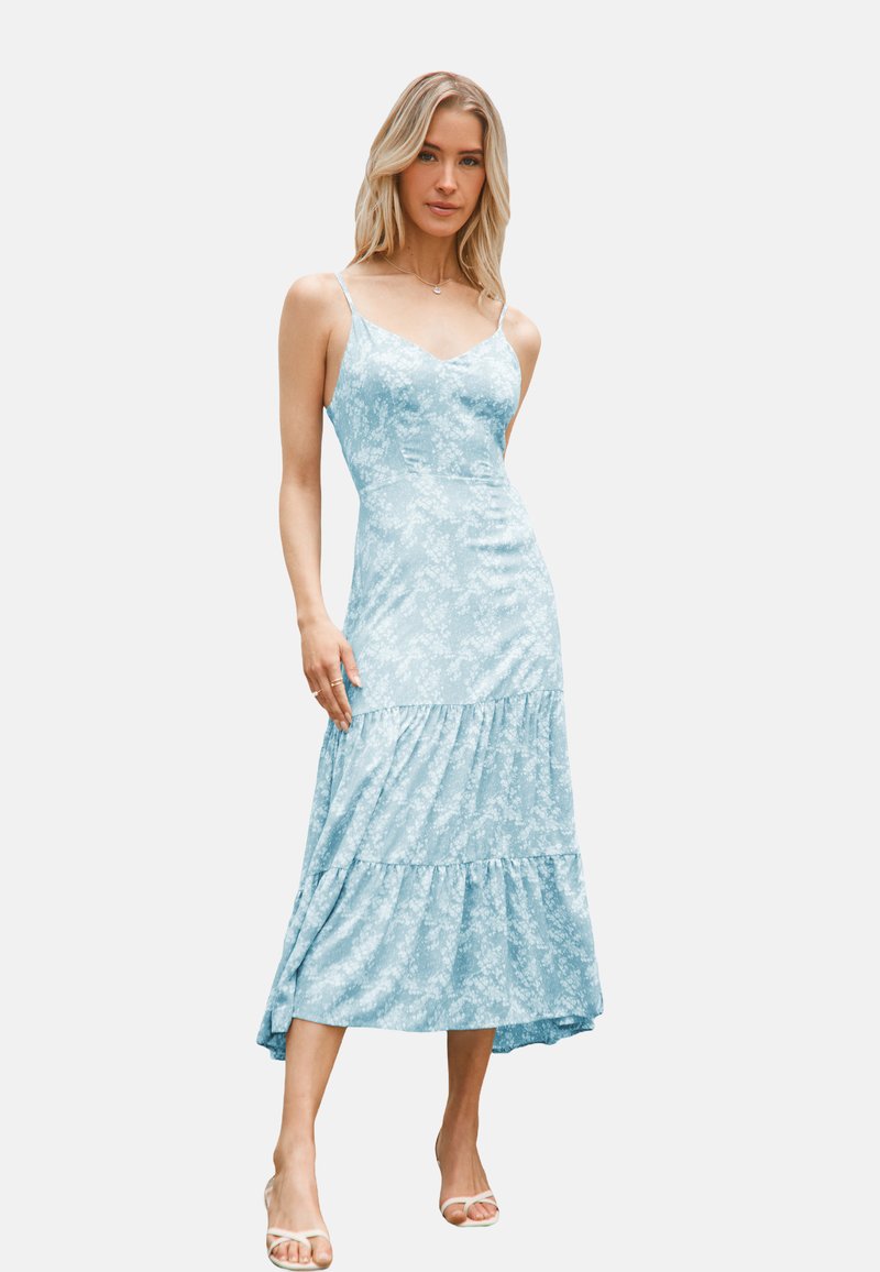 Abito midi floreale blu chiaro con spalline sottili, un corpo aderente e un orlo a balze a strati. Tessuto morbido con una superficie liscia.