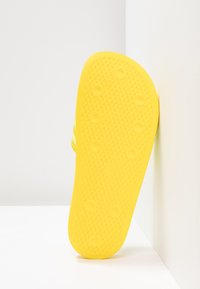 adidas Originals ADILETTE - Mules - yellow/semi frozen