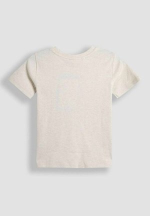 T-shirt a maniche corte di un leggero beige realizzato in morbido cotone. Presenta un collo rotondo e una schiena semplice, senza grafiche o motivi.