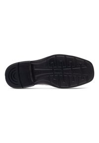 Suela de zapato de goma negra con patrones de banda de rodadura, que presenta una puntera redondeada y un ligero tacón. Superficie texturizada para un mejor agarre y durabilidad.