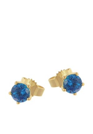 Pair of gold stud earrings with round deep blue faceted gemstones set in four-prong settings against a white background.