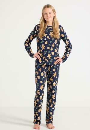 Navyblaues Pyjama-Set mit langen Ärmeln und Hosen, verziert mit Lebkuchenmännern, Sternen und festlichen Motiven in Beige und Grün. Aus weichem Baumwollmaterial.