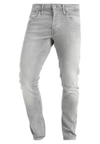 Jeans in denim grigio con vestibilità slim, design a cinque tasche e passanti per cintura. Presentano una leggera sbiaditura e dettagli cuciti lungo le cuciture.