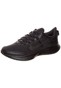 Chaussure de sport noire en matériau mesh, avec un bout arrondi, un design à lacets, et une semelle noire épurée dotée d'accents texturés.