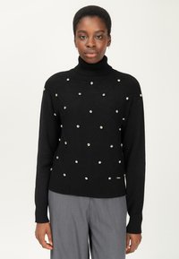 Schwarzer Rollkragenpullover mit einem strukturierten Rautenmuster, verziert mit silberfarbenen Perlen; gerippte Bündchen und Saum, mittelschweres Strickmaterial.