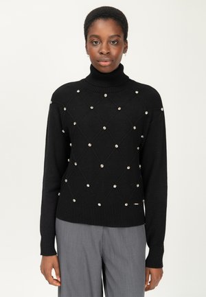 Schwarzer Rollkragenpullover mit einem strukturierten Rautenmuster, verziert mit silberfarbenen Perlen; gerippte Bündchen und Saum, mittelschweres Strickmaterial.
