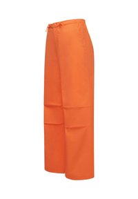 Orange wide-leg pants with elastic waistband and drawstring. Features deep side pockets and a smooth, lightweight fabric texture.