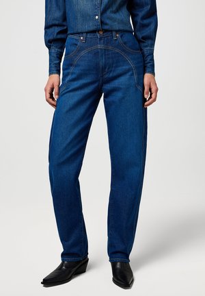Donkere spijkerbroek in een relaxed fit, met contrasterende stiksels en een hoge taille. Eenvoudige voorzakken en subtiele naden.