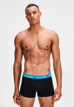 Svarta boxershorts med ett blått midjeband som har "JACK & JONES"-logotypen. Tillverkade av mjukt tyg, i en åtsittande design, och utan synliga mönster.