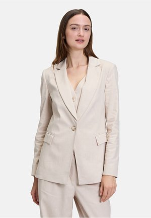 Lichtbeige blazer van gestructureerde stof, met een uitgesneden revers, twee knopen en voorzakken. Getailleerde pasvorm met een gestructureerde vorm.