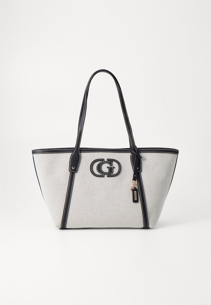 Sac cabas de couleur crème avec bordure noire, doubles anses et logo double-G métallique au centre avant.