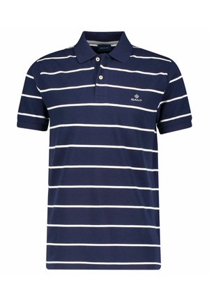 Navy blue short-sleeve polo shirt with white horizontal stripes, two-button placket, and small white GANT logo on left chest.