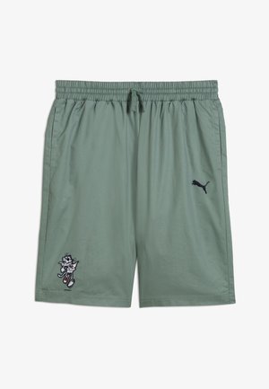 Shorts Puma en tissu vert doux, taille élastique avec cordon de serrage, ornés d'une broderie de personnage de dessin animé et d'un petit logo noir.