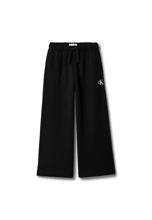 Pantalon noir à jambes larges avec taille élastique et cordon, avec un petit logo blanc « cK » sur la cuisse droite.
