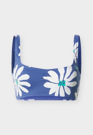 Sinine lühendatud topp laiade rihmadega, mis on kaunistatud suurte valgete ja roheliste lillemotiividega.