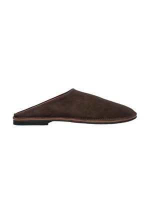 Brown suede slip-on mules with a rounded toe, low flat black sole, and stitched accents along the edge. Minimalist design and soft texture.
