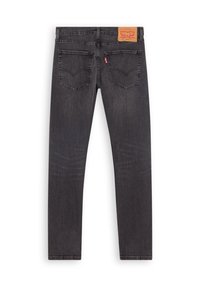 Jean slim gris foncé vu de dos avec deux poches, un patch en cuir marron Levi Strauss et une étiquette rouge Levi's sur la poche droite.