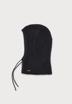 Cagoule noire en tricot avec deux cordons ajustables et un petit logo doré près du bord inférieur sur fond blanc.