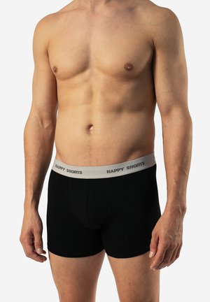 Black boxer shorts with a gray waistband featuring “HAPPY SHORTS” text. Soft fabric, fitted design, and smooth texture.