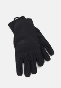 Gants noirs en matériau doux et extensible avec une surface lisse. Présente une prise texturée sur la paume et un logo au niveau du poignet.