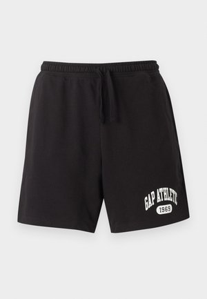 Pantaloni scurți sport negri cu talie elastică și șnur, având text alb „GAP ATHLETIC 1969” pe partea inferioară a piciorului stâng.