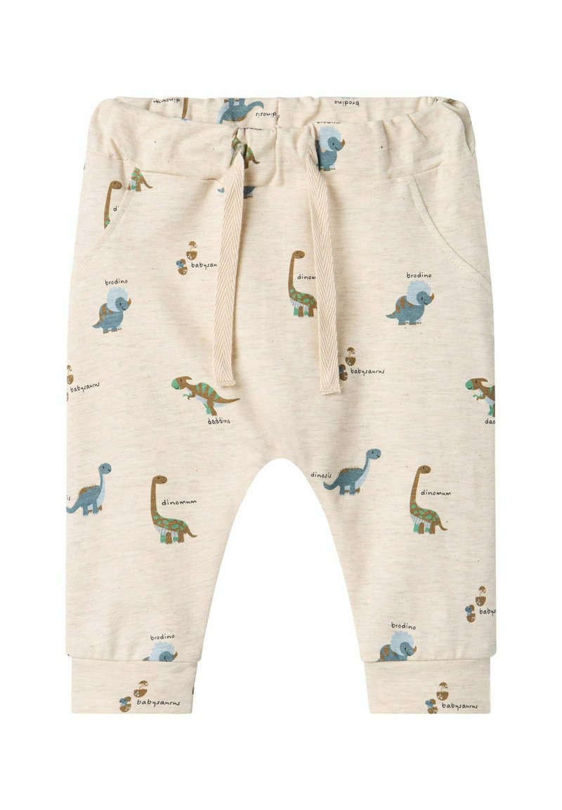 Pantalones de chándal para niños de color beige claro con patrones de dinosaurios en azul y verde. Cuentan con una cintura elástica y cordones para ajustarse.