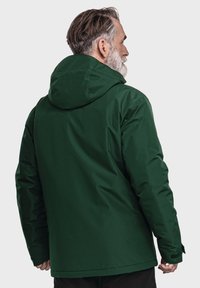Grüne, kapuzenjacke von hinten gezeigt, mit einer glatten Oberfläche und einem leicht lockeren Schnitt, verstellbaren Manschetten und einem schlichten Design.