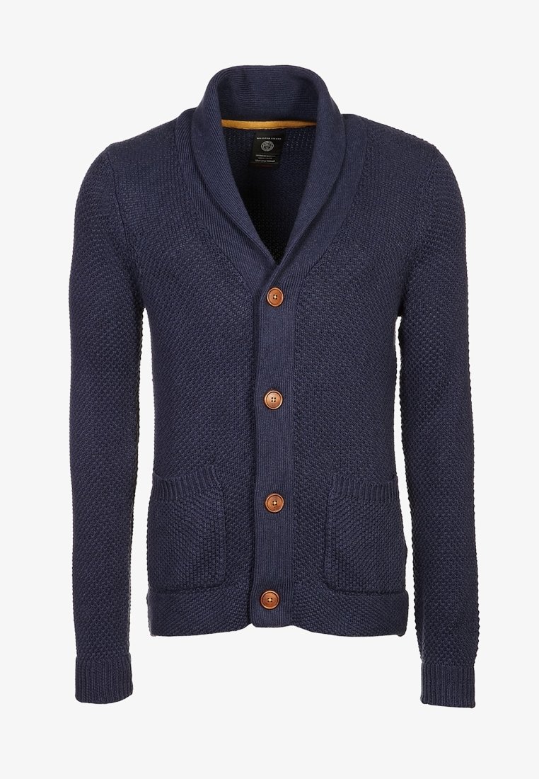Navy knitted cardigan with a shawl collar, five brown buttons, two front pockets, and ribbed cuffs and hem in a textured pattern.
