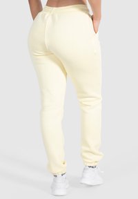 Smilodox CASSANDRA - Trainingsbroek - gelb