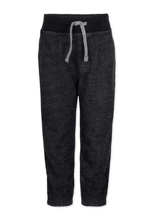 Donkergrijze gebreide broek met zwarte elastische tailleband en grijs trekkoord, taps toelopende pijpen en geribbelde boorden.