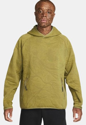 Felpa con cappuccio verde oliva con un motivo texture, dotata di tasca a marsupio e zip sui lati. Realizzata in tessuto morbido e resistente.