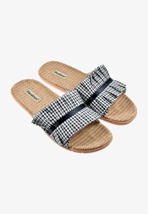 Sandalias deslizantes de cuadros en blanco y negro con una tira de tela con volantes, plantilla de yute texturizado y suela de goma para mayor agarre.