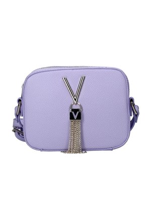 Lavender textured crossbody bag with silver zipper, large silver "V" emblem, and hanging silver chain tassel on front.