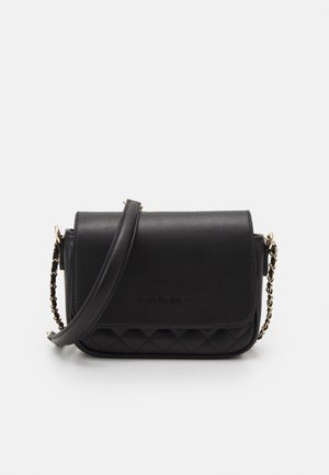 Black Valentino crossbody bag with quilted bottom, leather flap, and gold chain strap on a white background.