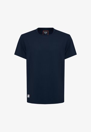 Navy blue short-sleeve crew neck T-shirt with a small white label near the bottom hem and a brand tag inside the collar.