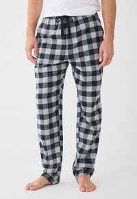 Pánske pyžamové nohavice v námorníckom a šedom kockovanom flaneli; elastický pás s šnúrkou; voľný strih; dlhý strih; mäkká textura.