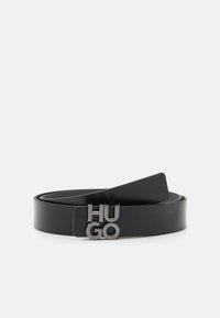 Schwarzer Leder Gürtel mit glatter Textur, ausgestattet mit einer metallischen Doppelbuchstaben-Paraschließe mit der Gravur "HUGO". Flexibles Band mit einem klaren, minimalistischen Design.