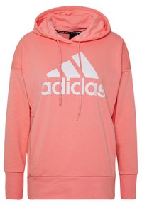 Sweat à capuche rose corail en mélange de coton. Il présente un grand logo Adidas blanc sur le devant et un cordon de serrage à la capuche.
