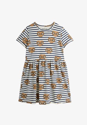 Lühikeste varrukatega kleit, millel on tumesinise ja valge triibuline muster, kaunistatud korduvate pruunide tulnuka pea graafikatega. Laienev seeliku disain.