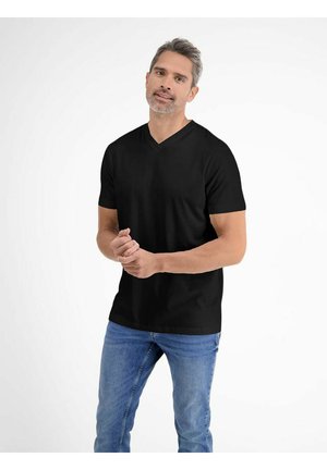 Black V-neck t-shirt made of soft fabric, short sleeves, and a relaxed fit, paired with blue jeans, standing against a light background.