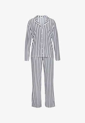 Gestreepte pyjama set met een blouse met lange mouwen en bijpassende broek. Kleuren zijn wit met marineblauwe strepen. Zachte stoftextuur.