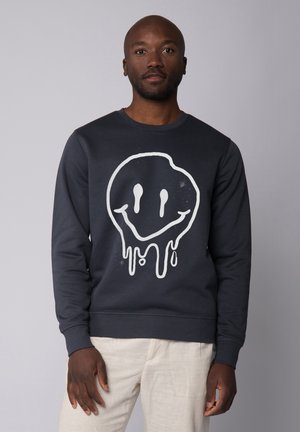 Navy sweatshirt gemaakt van een katoenmix met een grote witte smiley-gezichtafbeelding met druipdetails; de pasvorm is ruim met ribgebreide boorden.