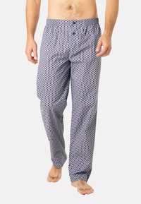 Pantalons de pyjama pour hommes en coton avec un motif à pois bleu marine et blanc, taille élastique avec deux boutons, et coupe ample.