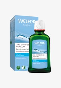 Weleda 2-in-1 Verfrissend Reinigingswater in een groene glazen fles met een witte dop, voorzien van een blauw en witte kartonnen doos met tekst.