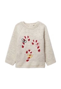 Pull en maille beige clair avec manches raglan. Motifs de cannes en sucre rouges avec nœuds roses, jaunes et verts. Tissu doux et texturé.