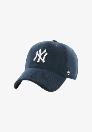 Navy blue corduroy baseball cap with white embroidered logo. Features metal eyelets and a slightly curved brim. Accented with a small logo on the side.