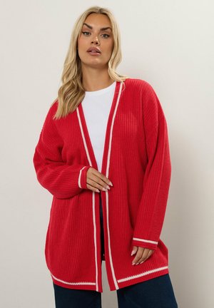 Cardigan rojo de canalé con rayas blancas en los bordes y puños. Mangas largas y diseño de apertura frontal, hecho de un material de punto texturizado.